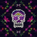 Embroidery skull and flowers. Ethnic mexican multicolor fabric background with colorful cranium element.